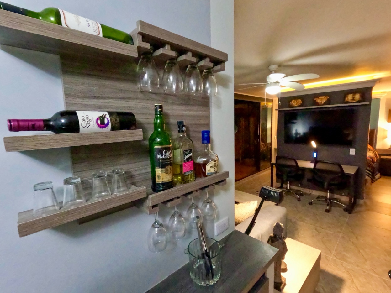 Wall bar shelf with wine rack and workspace behind