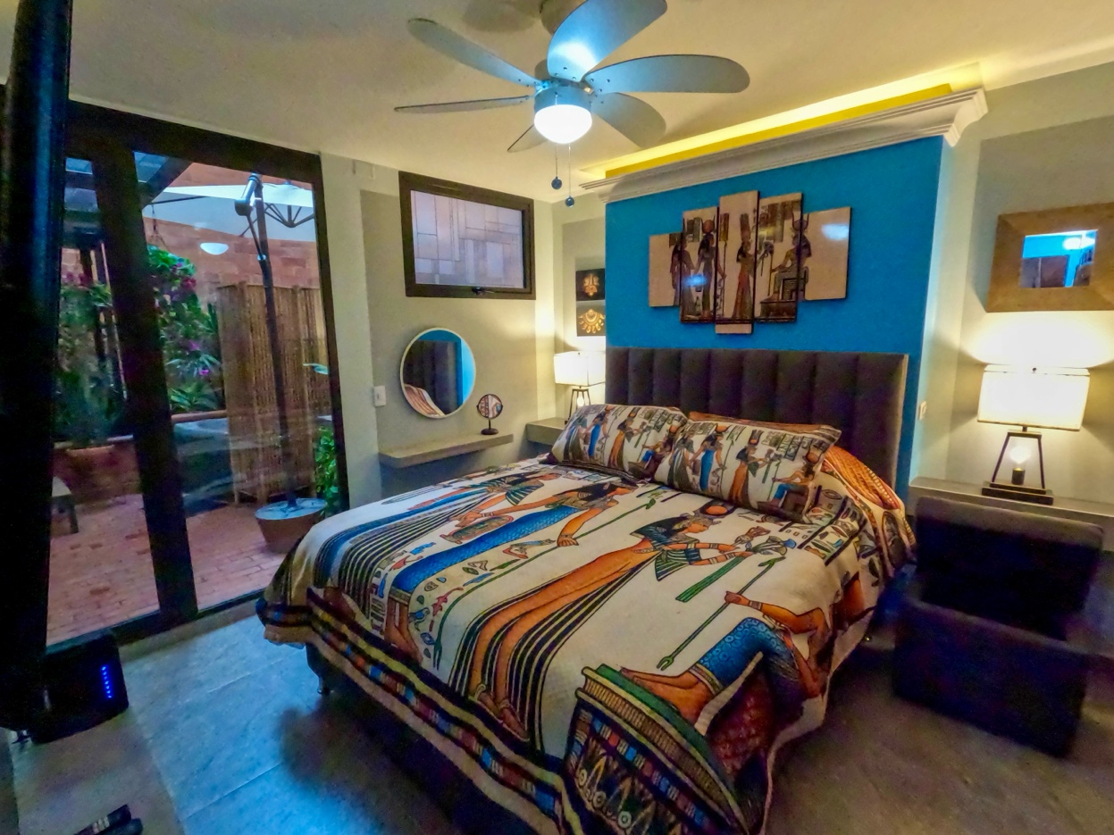 Bedroom full view with terrace visible through open French doors